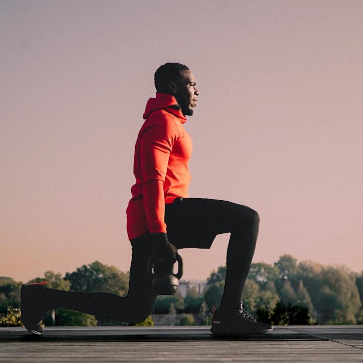 Women in a fitness class doing stretching and mobility exercises
